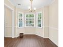 Cozy dining area with large bay window and ample natural light, perfect for Gathering meals at 2941 Governors Ct, Marietta, GA 30066