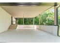 Spacious covered carport with a staircase, offering ample parking and sheltered access to the home at 3620 W Lawrenceville St, Duluth, GA 30096