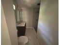 Bathroom with double sink, gray tile floor, and shower with gray subway tile at 4610 Wilson James Sw Rd, Atlanta, GA 30331