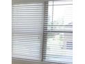 Close-up of a window featuring white blinds at 5896 Cliftondale Dr, Atlanta, GA 30349