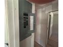 Electrical panel with visible circuits, wiring, and safety features, set in unfinished walls, inside view at 4601 Wilson James Sw Rd, Atlanta, GA 30331