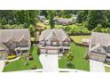 Beautiful home featuring manicured lawn, mature trees and an inviting outdoor space at 4972 Park Vale Dr, Sugar Hill, GA 30518