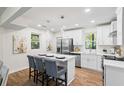 Modern, all-white kitchen with stainless steel appliances and a center island at 1270 Graymont Sw Dr, Atlanta, GA 30310