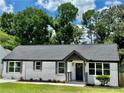 Beautifully renovated one-story home featuring a painted brick exterior, gray accents, and freshly landscaped yard at 1937 Don Juan Ln, Decatur, GA 30032