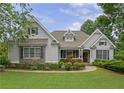Beautiful home with stone accents, mature landscaping and inviting front porch at 130 Holly Reserve Pkwy, Canton, GA 30114