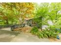 Charming home with mature trees and lush landscaping creates a private, picturesque setting at 5848 Kingswood Ct, Norcross, GA 30093