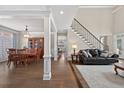 Open concept living space with hardwood floors and a staircase at 1232 Everton Pl, Cumming, GA 30041