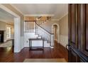 Elegant foyer featuring hardwood floors, a staircase, and classic trim detailing at 27 S Avondale Rd, Avondale Estates, GA 30002