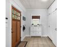 Bright entryway features custom built-in cabinets and a stylish shoe bench at 1556 Braeburn Se Dr, Atlanta, GA 30316