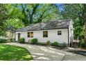 Front exterior view of house, showcasing landscaping and driveway at 1556 Braeburn Se Dr, Atlanta, GA 30316
