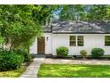 Home's entrance with a well-maintained lawn and inviting facade at 1556 Braeburn Se Dr, Atlanta, GA 30316