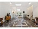 Unique foyer with high ceilings, stone floors, and skylights creates an open and inviting space at 285 Glen Lake Dr, Atlanta, GA 30327