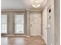 Inviting entryway featuring hardwood floors and natural light, creating a warm first impression at 4562 Lucerne Valley Sw Rd, Lilburn, GA 30047