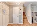 Welcoming entryway with hardwood floors, natural light and staircase at 4562 Lucerne Valley Sw Rd, Lilburn, GA 30047