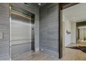 Modern elevator features sleek stainless steel doors and stylish wall coverings at 1301 Peachtree Ne St # 4L, Atlanta, GA 30309