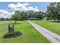 Sprawling front yard with a long driveway leading to the beautiful home at 3152 H D Atha Rd, Covington, GA 30014