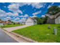Neat front yard of house, set back on a quiet street, perfect for a Gathering or first-time home buyer at 5916 Farmbrook Ln, Rex, GA 30273