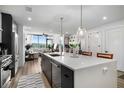 Open concept kitchen with seating at the island, stainless appliances, and eat-in area at 788 W Marietta Nw St # 308, Atlanta, GA 30318