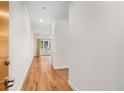 Hallway featuring hardwood floors leading to a bright living space with doors to a patio at 384 Ralph Mcgill Ne Blvd # 123, Atlanta, GA 30312