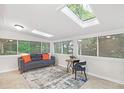 Bright and airy sunroom featuring skylights, large windows and comfortable seating at 3852 Vinyard Ne Ct, Marietta, GA 30062