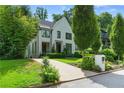 View of the attractive exterior showcasing its driveway and meticulous landscaping at 1433 Wessyngton Ne Rd, Atlanta, GA 30306