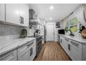 Modern kitchen featuring white cabinetry, stainless steel appliances, and stylish marble countertops at 2432 Kelly Lake Dr, Decatur, GA 30032
