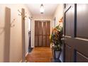 Inviting foyer with hardwood floors, a closet, and a decorative plant at 265 Forest Lake Dr, Covington, GA 30016