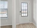 A clear view of the glass paneled front door with white trim at 386 Tallulah Ln, Grayson, GA 30017