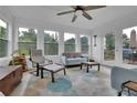 Bright sunroom with neutral color palette and lots of windows providing natural light at 3992 Spot Rd, Cumming, GA 30040