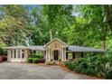 Charming brick home with lush landscaping, inviting entrance, and a well-maintained front yard at 5114 N Ivy Ne Rd, Atlanta, GA 30342