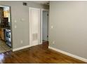 The living room has wood flooring and an entry view of the kitchen at 561 Formwalt Sw St # 7, Atlanta, GA 30312