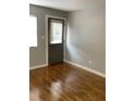 Neutral living room featuring natural light, wood-look flooring, and fresh gray paint at 561 Formwalt Sw St # 7, Atlanta, GA 30312