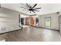 Spacious living room featuring hardwood floors, a modern ceiling fan, and an open floor plan at 1902 Memorial Se Dr, Atlanta, GA 30317