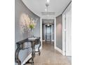 Hallway with neutral colors, decorative table and light fixture at 3344 Peachtree Ne Rd # 3504, Atlanta, GA 30326