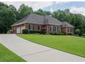 Lovely brick home with an attached two-car garage and well-kept grounds at 753 Summer Ridge Dr, Villa Rica, GA 30180