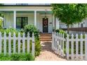 Inviting home entrance with brick walkway, tidy landscaping, and a decorative wreath on the front door at 174 Pearl Se St, Atlanta, GA 30316