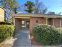 Charming brick home with covered walkway, lovely landscaping and mature trees in a well maintained community at 3301 Henderson Mill Rd # 1, Atlanta, GA 30341