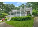 Beautiful home showcasing a spacious front porch, brick accents, and well-maintained lawn at 3358 Lake Dr, Lawrenceville, GA 30044