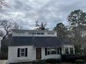 Charming exterior of a two-story home with black shutters and a classic front door at 1867 Dresden Dr, Atlanta, GA 30319