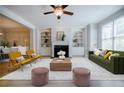 Bright and airy living room with built-in shelves, fireplace, and large windows at 5210 Davenport Pl, Roswell, GA 30075