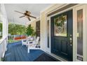 Charming front porch featuring a porch swing and elegant glass paneled front door at 2653 W Main Nw St, Atlanta, GA 30318