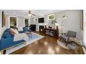 Inviting living room with a fireplace, modern furniture, and ample natural light at 2653 W Main Nw St, Atlanta, GA 30318