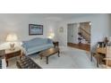 Cozy living room featuring a comfortable sofa and elegant decor at 711 Belgrave Ln, Tucker, GA 30084