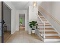 Inviting foyer with wood floors, a staircase, and a view to the outside at 1863 Wicks Valley Ne Dr, Marietta, GA 30062
