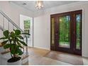 Elegant foyer featuring a decorative front door and tiled flooring at 1863 Wicks Valley Ne Dr, Marietta, GA 30062