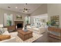 Comfortable living room with fireplace, neutral decor, and ample natural light at 250 Meadow View Dr, Grayson, GA 30017