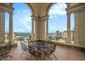 Outdoor terrace with stone arches, seating, and scenic city views at 75 Ponce De Leon Ne Ave # 1004, Atlanta, GA 30308