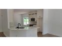 Bright kitchen boasts new appliances, stone countertops, subway tile backsplash, and custom cabinets at 5502 Lakeview Parkway, Villa Rica, GA 30180