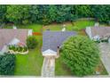 Aerial view of a well-maintained property with a lush green lawn and mature trees at 949 Harbins Pass Dr, Dacula, GA 30019