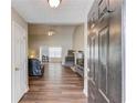 Open-concept living room featuring hardwood floors, fireplace, and plenty of natural light at 949 Harbins Pass Dr, Dacula, GA 30019